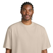 Model wearing District DT7075 7-oz Gritty Tee