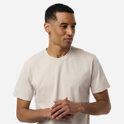 Model wearing Independent Trading Co PRM180PT Unisex Premium Pigment-Dyed T-Shirt